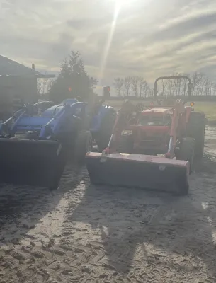 Two tractors in a sandy field