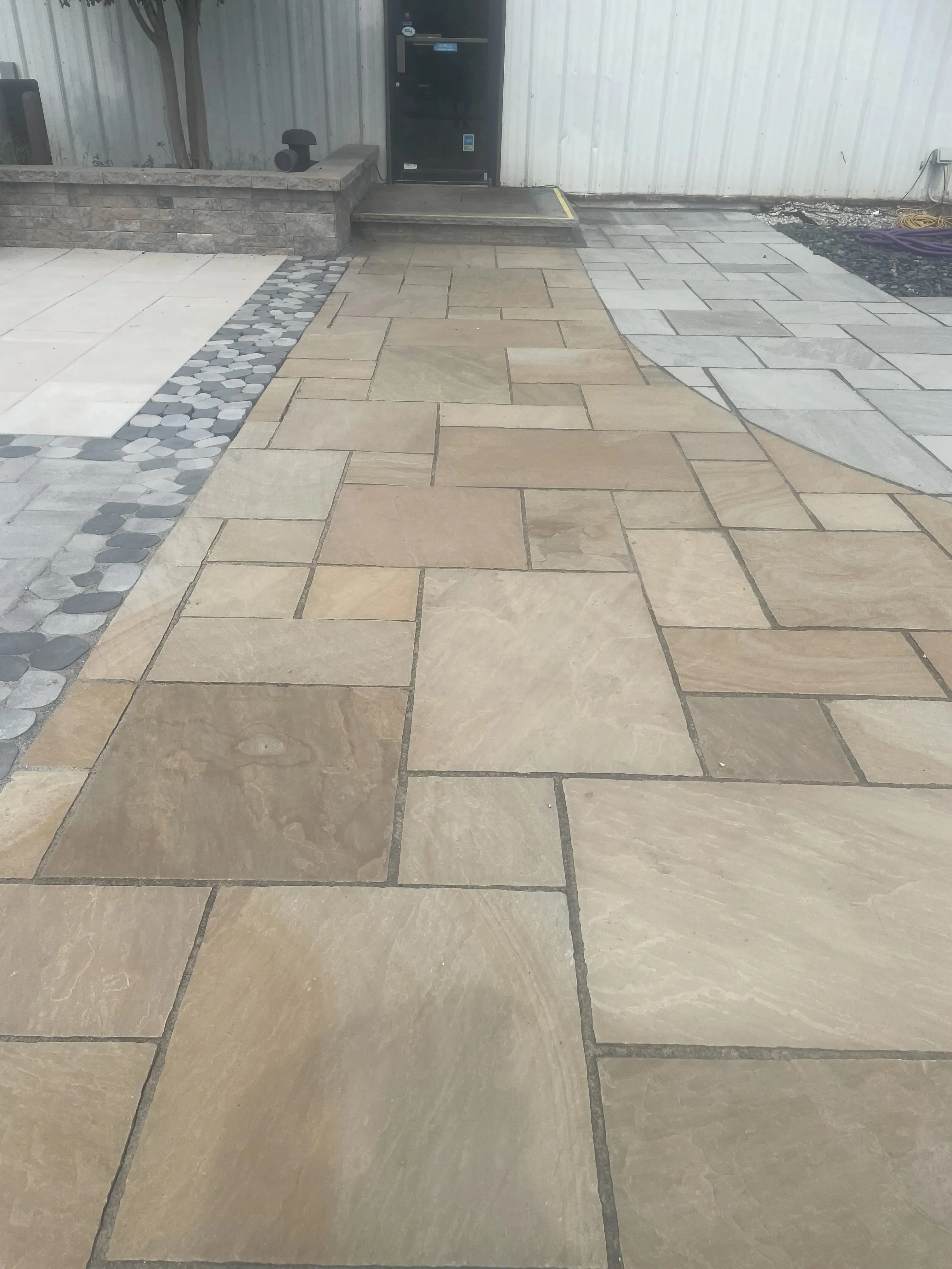 Stone patio with decorative tile work