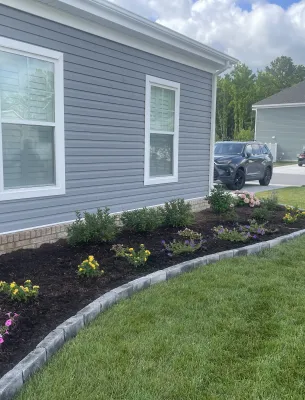 Side view of landscaped garden and lawn