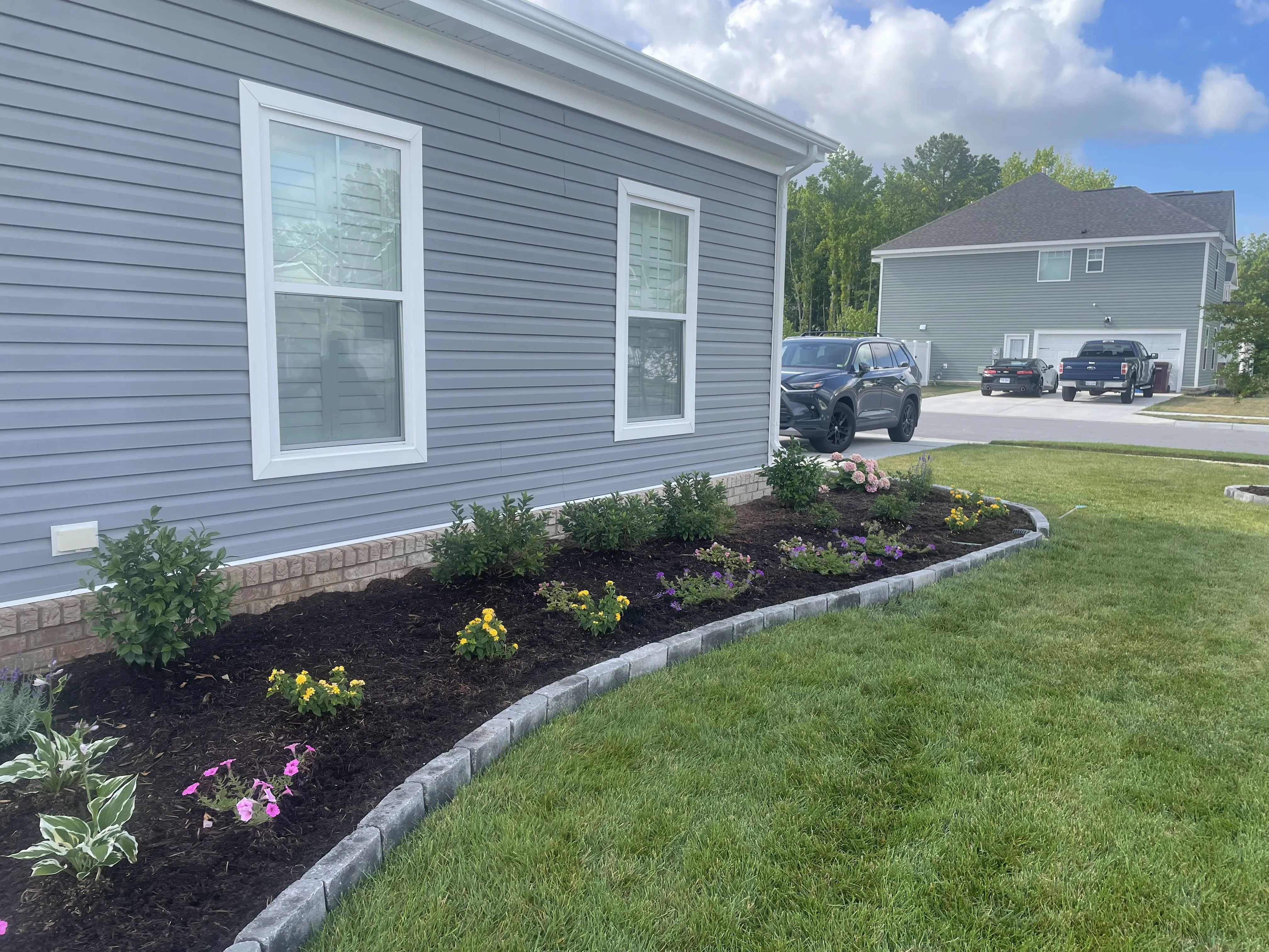 Side view of landscaped garden and lawn