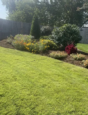 Well-maintained lawn with colorful flowers